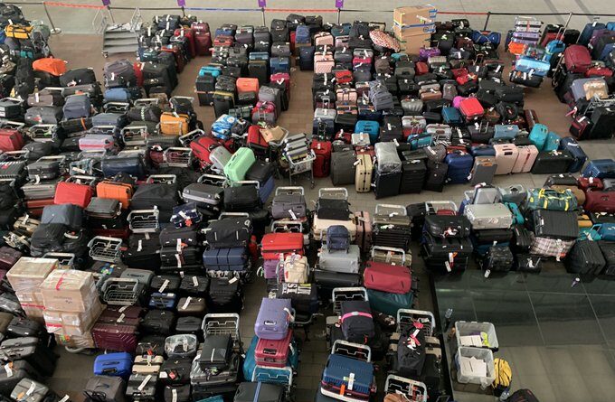 Heathrow airport turns an ocean of luggage after major technical snag. Passengers share clips and pics